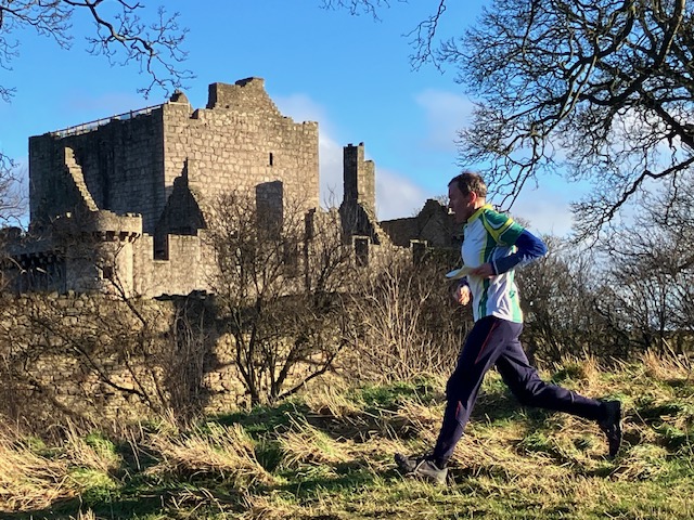 Runner_running_past_castle_by_Katherine_Ivory